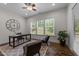 Office features a large window, hardwood floors, a ceiling fan, and modern decor at 420 Creekhurst Pl, Cary, NC 27519