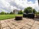 Backyard patio featuring a fire pit and barbeque perfect for outdoor relaxation and entertaining guests at 4266 Aviemore Run, Burlington, NC 27215
