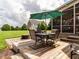 Outdoor dining and fire pit area, perfect for entertaining, complete with backyard view at 4266 Aviemore Run, Burlington, NC 27215