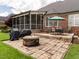 Outdoor space featuring a brick patio, fire pit, barbeque and deck with dining set, perfect for entertainment at 4266 Aviemore Run, Burlington, NC 27215
