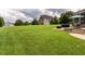 Expansive backyard offers a lush green lawn and ample space for outdoor activities and recreation at 4266 Aviemore Run, Burlington, NC 27215