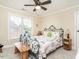 Bright bedroom with a decorative bed frame and well-lit window at 4266 Aviemore Run, Burlington, NC 27215