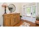 Light and airy foyer featuring hardwood floors, stylish furnishings, and a welcoming ambiance at 4266 Aviemore Run, Burlington, NC 27215