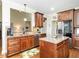 Spacious kitchen with granite countertops, stainless steel appliances, and hardwood floors at 4266 Aviemore Run, Burlington, NC 27215