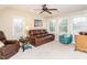 Cozy living room with leather sofa, comfortable seating and natural light at 4266 Aviemore Run, Burlington, NC 27215