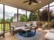 Enjoy this cozy screened-in porch offering stylish seating and a view of the lush backyard at 4266 Aviemore Run, Burlington, NC 27215