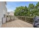 Large back deck with wood floors, backyard views and a grill for outdoor entertainment at 4621 Youngsbury Ct, Raleigh, NC 27604