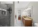 Bathroom featuring marble and natural finishes, walk-in shower, and granite countertops at 4621 Youngsbury Ct, Raleigh, NC 27604