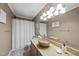 Bathroom featuring natural colors, granite countertops, and tub/shower combo at 4621 Youngsbury Ct, Raleigh, NC 27604