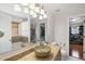 Bathroom featuring marble and natural finishes, walk-in shower, and granite countertops at 4621 Youngsbury Ct, Raleigh, NC 27604