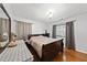 Bedroom with hardwood floors and soft lighting at 4621 Youngsbury Ct, Raleigh, NC 27604
