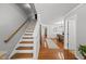 Entryway with hardwood floors leading to a dining room and staircase to the left at 4621 Youngsbury Ct, Raleigh, NC 27604