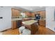 Spacious kitchen with stainless steel appliances, kitchen island and granite counters at 4621 Youngsbury Ct, Raleigh, NC 27604
