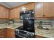 Close up on kitchen features, including stainless steel oven and microwave at 4621 Youngsbury Ct, Raleigh, NC 27604