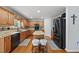 Well-equipped kitchen featuring stainless steel appliances, island, and granite countertops at 4621 Youngsbury Ct, Raleigh, NC 27604