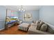 Cozy living room featuring blue walls, a patterned ottoman, and a comfortable sofa at 4621 Youngsbury Ct, Raleigh, NC 27604