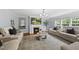 Inviting living room featuring a fireplace and ample seating for entertaining at 4621 Youngsbury Ct, Raleigh, NC 27604