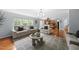 Open-concept living room with a view of the kitchen and plenty of natural light at 4621 Youngsbury Ct, Raleigh, NC 27604