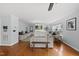 Bright and airy living room with hardwood floors and cozy seating arrangement at 4621 Youngsbury Ct, Raleigh, NC 27604