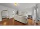 Spacious main bedroom with hardwood floors and ample natural light at 4621 Youngsbury Ct, Raleigh, NC 27604