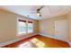 Bedroom with hardwood floors, ceiling fan, natural light and neutral colored walls at 504 Hillcrest Ave, Burlington, NC 27215