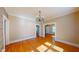 Elegant dining room with hardwood floors, chandelier, and open access to adjacent rooms at 504 Hillcrest Ave, Burlington, NC 27215