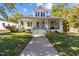 Inviting home exterior featuring a wide front porch and a well-manicured lawn at 504 Hillcrest Ave, Burlington, NC 27215