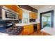 Kitchen showcasing stainless steel microwave, gas range, and cabinetry at 504 Hillcrest Ave, Burlington, NC 27215