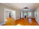 Spacious living room with hardwood floors, and large entryways to other rooms at 504 Hillcrest Ave, Burlington, NC 27215