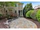 Beautiful backyard showcasing a stone patio, vibrant roses, and lush greenery enhancing the home's outdoor appeal at 528 Bankhead Dr, Cary, NC 27519