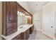Bathroom with dual sink vanity with dark wood cabinets and light countertops at 528 Bankhead Dr, Cary, NC 27519