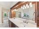 A spacious bathroom featuring a double sink vanity, soaking tub, and a separate shower with natural light at 528 Bankhead Dr, Cary, NC 27519