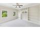 An inviting bedroom with built-in bookshelves and large windows for lots of natural light at 528 Bankhead Dr, Cary, NC 27519