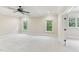 Spacious bedroom with coffered ceiling, fan, neutral walls and carpet, and windows at 528 Bankhead Dr, Cary, NC 27519