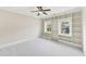 A bright bedroom featuring built-in shelving and large windows for lots of natural light at 528 Bankhead Dr, Cary, NC 27519