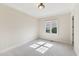 Neutral bedroom featuring carpet flooring, crown molding, and a window with a view at 528 Bankhead Dr, Cary, NC 27519