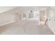 Spacious bonus room with neutral carpet, built-in shelving, and a cozy window seat at 528 Bankhead Dr, Cary, NC 27519