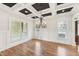 Formal dining room with wainscoting, hardwood floors, and a decorative chandelier at 528 Bankhead Dr, Cary, NC 27519