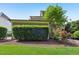 Green home exterior featuring manicured hedges, green grass and mulch, providing privacy and curb appeal at 528 Bankhead Dr, Cary, NC 27519