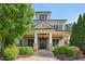 Inviting two-story home featuring stone accents, a welcoming front porch, and lush landscaping at 528 Bankhead Dr, Cary, NC 27519