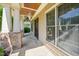 Elegant front porch with stone pillars, wood ceiling, and tiled flooring, offering a warm welcome at 528 Bankhead Dr, Cary, NC 27519