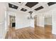 Elegant living room with coffered ceilings, hardwood floors, and recessed lighting at 528 Bankhead Dr, Cary, NC 27519