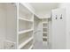 Walk-in closet featuring ample shelving, rods, and hooks for optimal organization at 528 Bankhead Dr, Cary, NC 27519