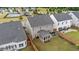 Aerial view of the property, with a screened in porch, patio, and fenced backyard at 5292 Goosecross Way, Fuquay Varina, NC 27526