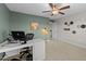 Bedroom/office with a ceiling fan, carpet, desk and decoratively adorned walls at 5292 Goosecross Way, Fuquay Varina, NC 27526