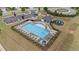 Aerial view of the community pool, seating, playground, and parking at 5292 Goosecross Way, Fuquay Varina, NC 27526