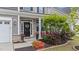 Inviting front porch with stylish planters and a cozy seating area at 5292 Goosecross Way, Fuquay Varina, NC 27526