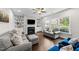 Cozy living room featuring a fireplace, built-in bookshelves, and comfortable seating at 5292 Goosecross Way, Fuquay Varina, NC 27526