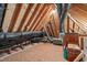 A spacious unfinished attic with exposed wood framing and ample storage space at 5410 Highcroft Dr, Cary, NC 27519