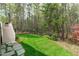 Picturesque backyard with lush greenery, mature trees, and meticulously manicured landscaping at 5410 Highcroft Dr, Cary, NC 27519